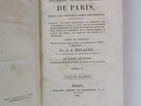 a book opened on a white surface with a black and white title