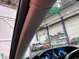 a view of a car ' s dashboard from inside of a vehicle