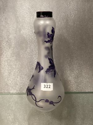 a glass vase that has a black and white design on it