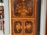 a cabinet that has been decorated with flowers on it