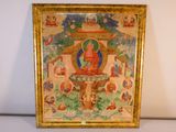 tableau représentant un Bouddha dans un cadre doré, sur un fond blanc