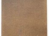 a close up of a piece of cardboard on a white surface