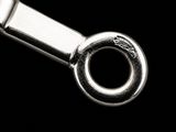 a close up of a metal object on a black background