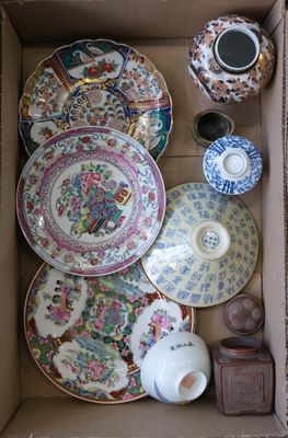 a box full of china plates and bowls in it