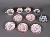 many different types of china plates and cups on the table