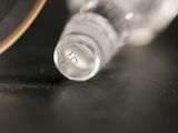 a close up of a bottle of water on a table