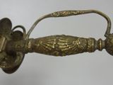 a close up of a sword with a handle