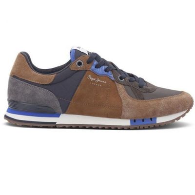 a close up of a brown and blue sneaker on a white background