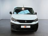 the white van is parked in a large room with white walls