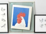 three framed pictures on the wall of a room