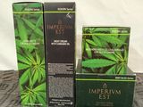 three boxes of imperial estt on a bed next to each other