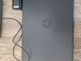 a laptop and a keyboard on a table with a mouse