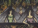 three women that are standing in front of a table