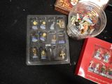 a plastic container filled with lego figures next to a plastic container filled with lego figures