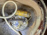 a close up view of a dirty tire with a hose