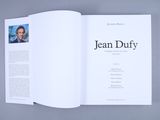 an open book with a picture of a man on it