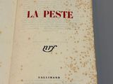 a book open on a table with writing on it