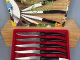 four knives in a box with a box of knives