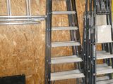 a ladder that is leaning against a wall in a garage