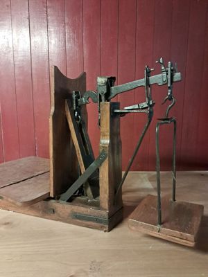 a small machine that is sitting on a wooden table