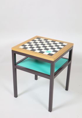 a small table with a chess board on top of it