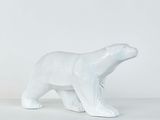 white ceramic polar bear figurine on a white background