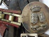 a close up of a belt with a crown on it
