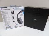 the box is open on the table next to the box of the headphones