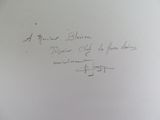 handwriting on a piece of paper with a picture of a man
