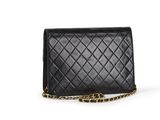 a black quilted purse with a chain strap and a leopard print strap