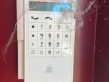 an image of a phone with a spider web attached to it
