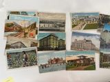 many postcards of different buildings on the table