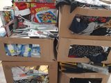 a cart with many boxes of clothing on top of it