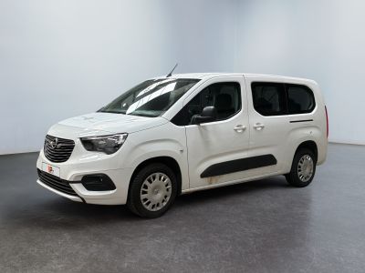 the white van is parked in a room with a gray floor