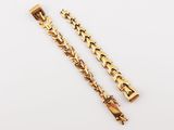 a pair of gold plated bracelets
