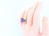 an image of a woman ' s hand with a ring on it