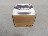 a box that has a picture of a man ' s face on it