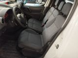 the interior of a white car with black seats and a steering wheel
