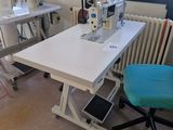 a sewing machine sitting on a table in a room