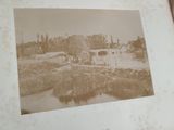 an old photo of a bridge over a river in a book