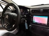 the interior of a car with a steering wheel and dashboard controls