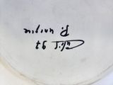 a close up of a plate with writing on it