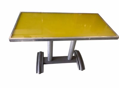 table with yellow glass top and metal legs