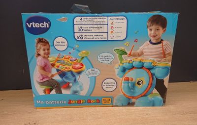 a box with a picture of a boy and a girl playing with toys