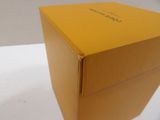 a yellow box that is sitting on a white table