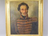 an oil painting of a man in a military uniform in a gold frame