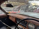 dashboard of an old car with a lot of cars in the background