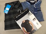two men ' s shirts, a polo shirt, and a pair of pants are on a couch