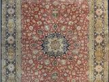 a red and gold rug with a medallion design on it