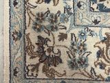 an area rug with a blue and brown design on it